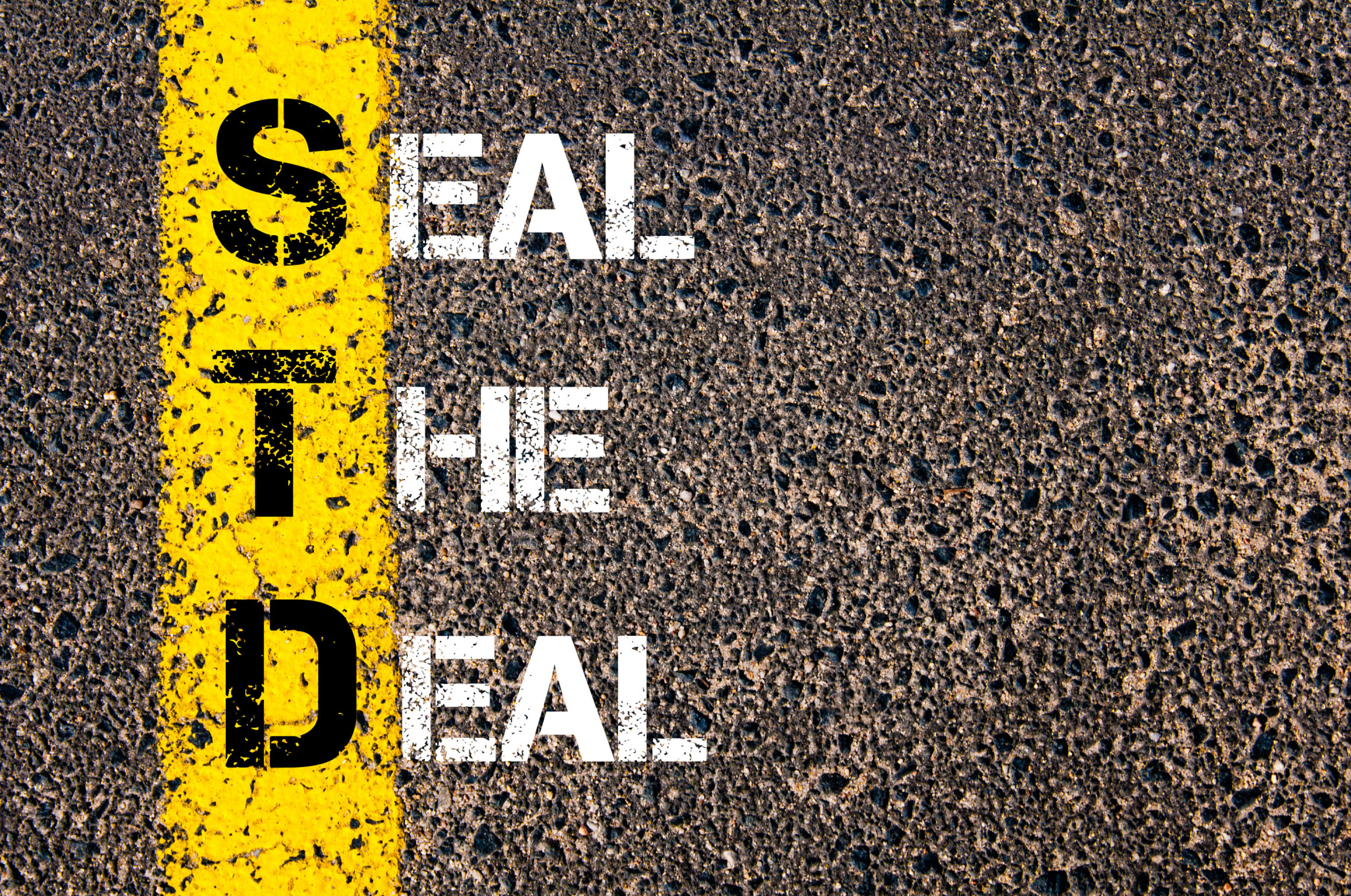 STD Acronym on Asphalt - Seal the Deal